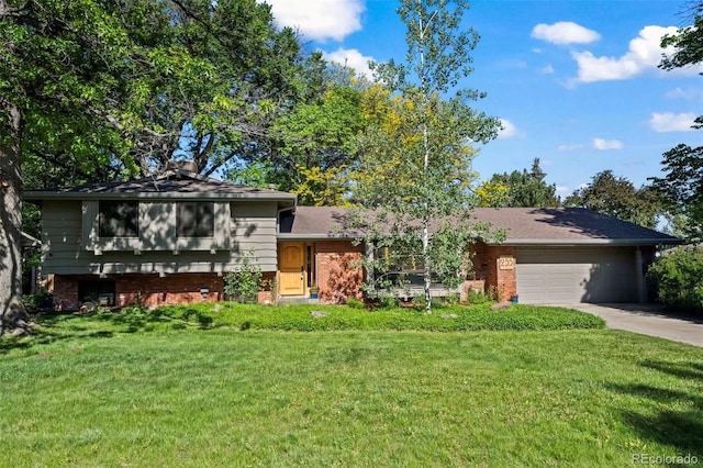 255 Kiowa Pl, Boulder, CO 80303 - tri-level home with an attached garage, a front lawn, concrete driveway, and brick siding