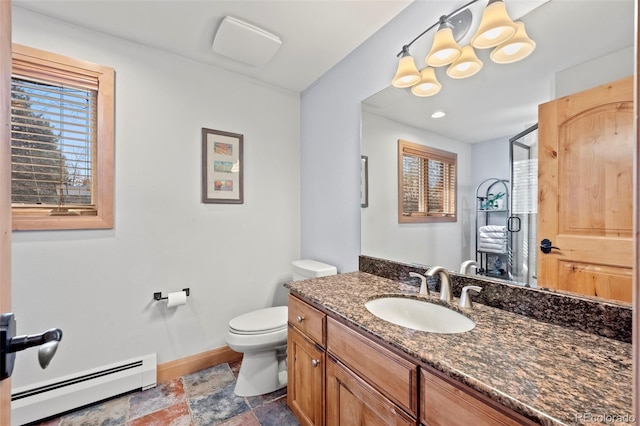 255 Kiowa Pl, Boulder, CO 80303 - bathroom featuring a baseboard heating unit, toilet, vanity, baseboards, and stone finish floors