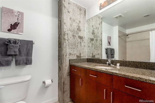 1700 Bassett St Unit 409, Denver, CO 80202 - bathroom with vanity, toilet, and baseboards