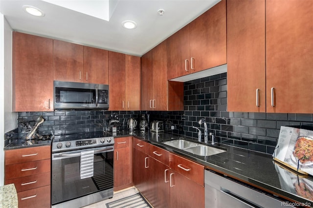 1700 Bassett St Unit 409, Denver, CO 80202 - kitchen with stainless steel appliances, a sink, dark stone counters, and recessed lighting