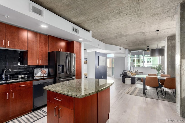 1700 Bassett St Unit 409, Denver, CO 80202 - kitchen featuring a sink, refrigerator with ice dispenser, dishwasher, a kitchen island, and ceiling fan