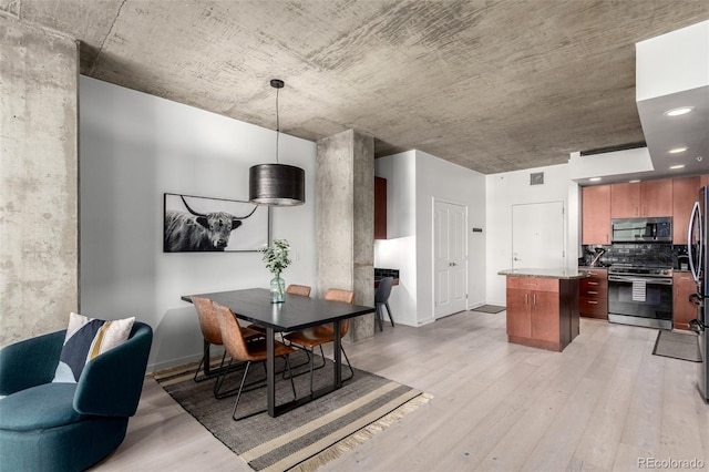 1700 Bassett St Unit 409, Denver, CO 80202 - dining room featuring light wood-type flooring, baseboards, and recessed lighting