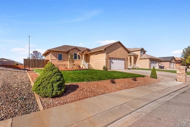 ranch-style home featuring a garage and a front yard