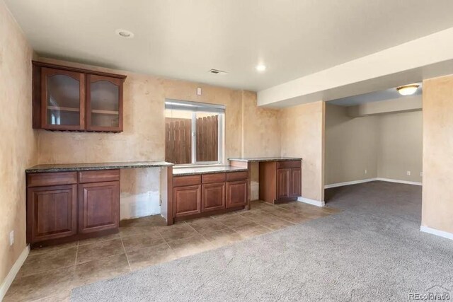 kitchen with light colored carpet