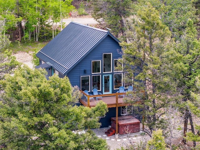 2946 Middle Fork Vis, Fairplay, CO 80440 - back of house featuring a deck and a hot tub