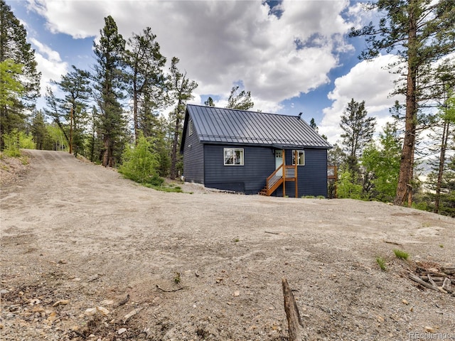 2946 Middle Fork Vis, Fairplay, CO 80440 - view of front of home featuring a standing seam roof, a metal roof, and dirt driveway