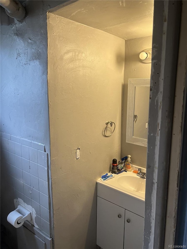 188 S Dale Ct, Denver, CO 80219 - half bathroom featuring vanity and toilet