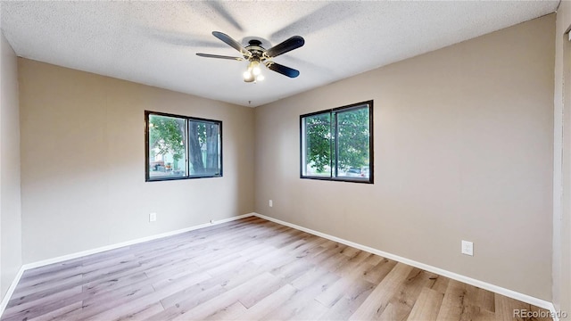 8509 Colorado Ct, Denver, CO 80229 - unfurnished room with wood finished floors, a ceiling fan, baseboards, and a textured ceiling