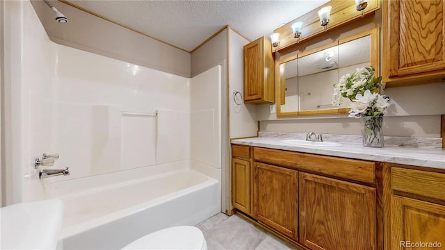 8509 Colorado Ct, Denver, CO 80229 - full bathroom with tile patterned floors, bathtub / shower combination, a textured ceiling, vanity, and toilet