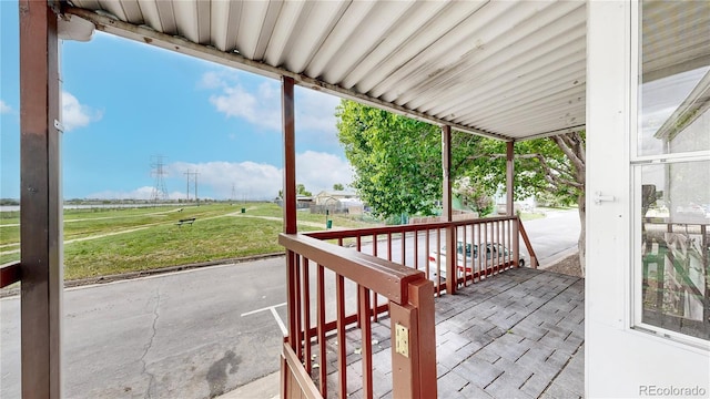 8509 Colorado Ct, Denver, CO 80229 - wooden porch featuring a lawn