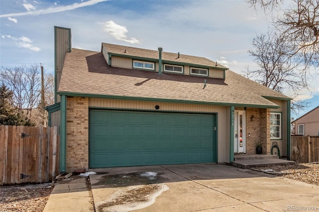 view of front of home with driveway, a shingled roof, fence, and brick siding