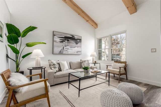 living area featuring high vaulted ceiling, baseboards, beam ceiling, and wood finished floors