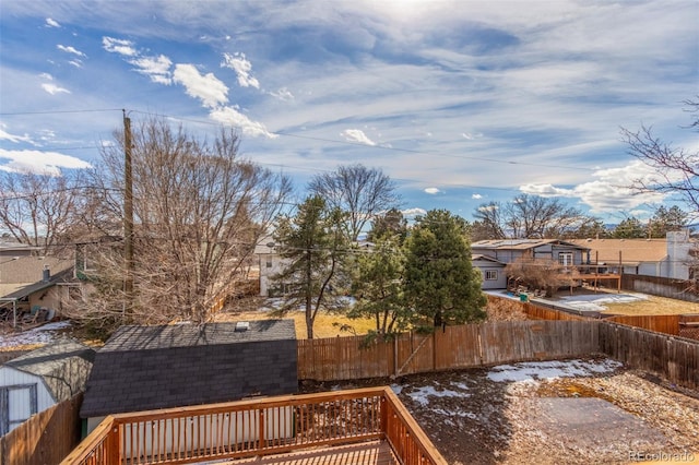 exterior space featuring a fenced backyard and a deck