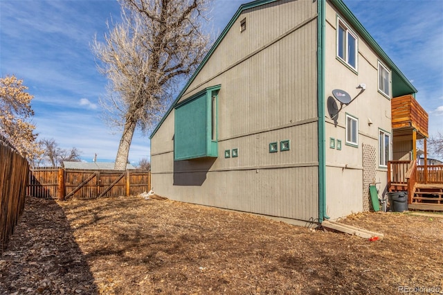 view of side of home featuring a fenced backyard