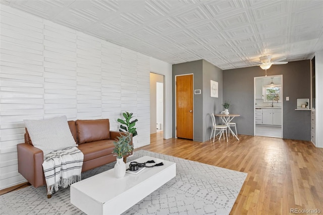 1638 N Foote Ave, Colorado Springs, CO 80909 - living room featuring light wood-type flooring, ceiling fan, and an ornate ceiling