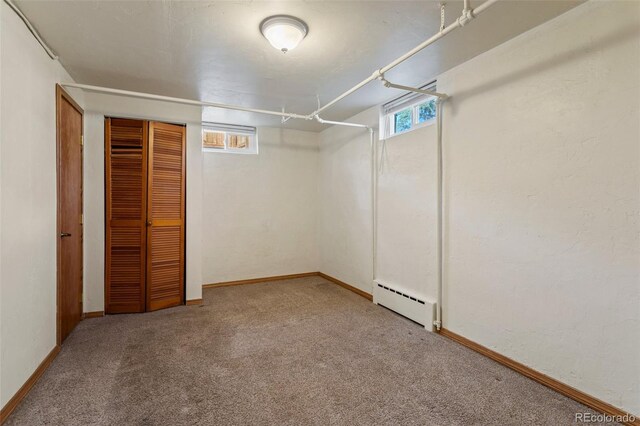 1638 N Foote Ave, Colorado Springs, CO 80909 - below grade area featuring a baseboard heating unit, baseboards, and carpet flooring