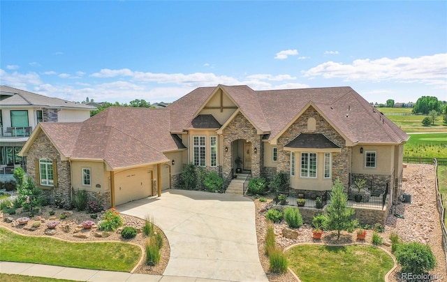 2131 Driver Ln, Erie, CO 80516 - view of front of home featuring stone siding, stucco siding, and an attached garage