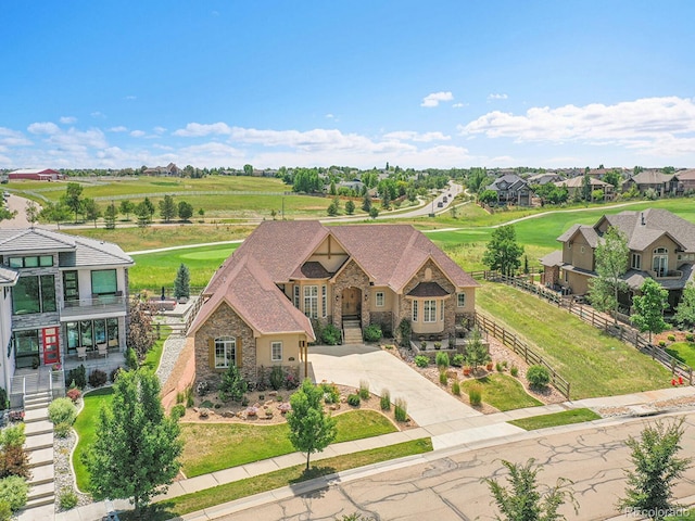 2131 Driver Ln, Erie, CO 80516 - view of front of house featuring stone siding and concrete driveway