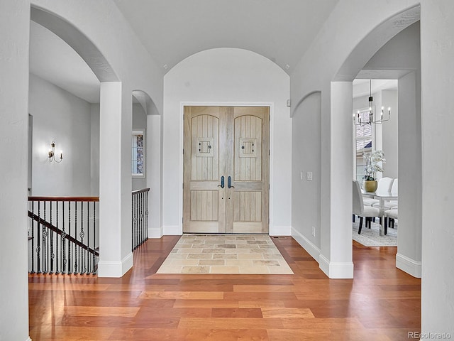 2131 Driver Ln, Erie, CO 80516 - foyer with wood finished floors and a chandelier