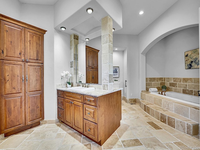 2131 Driver Ln, Erie, CO 80516 - full bathroom featuring stone tile flooring, vanity, a bath, and recessed lighting