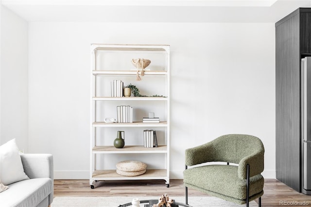 sitting room with light hardwood / wood-style flooring