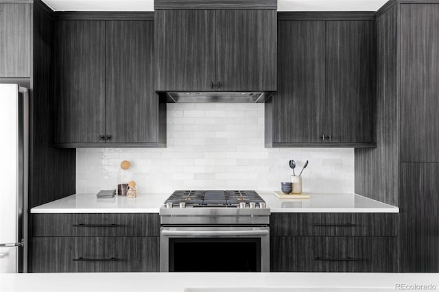 kitchen with backsplash, exhaust hood, and appliances with stainless steel finishes