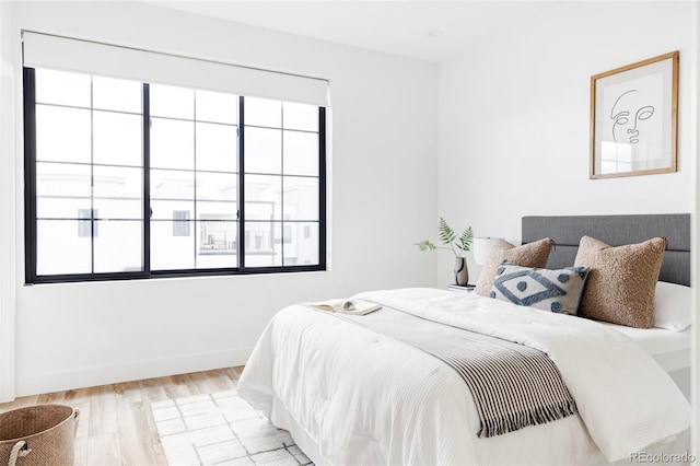 bedroom with light wood-type flooring