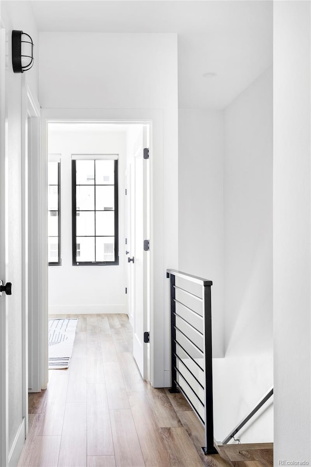 corridor with light wood-type flooring