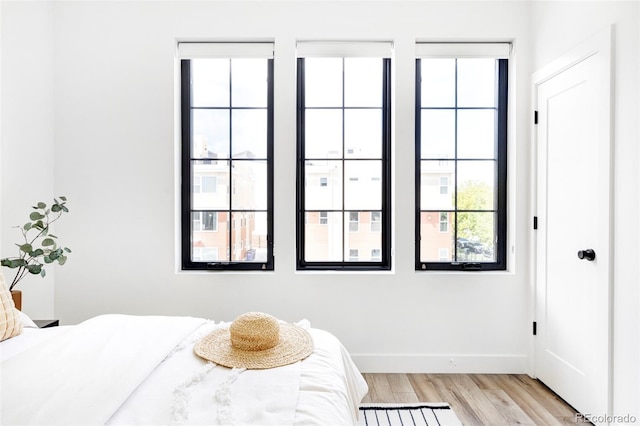 bedroom with light wood-type flooring