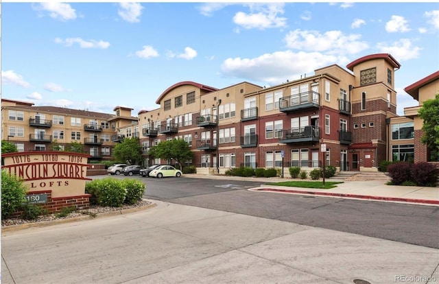 10184 Park Meadows Dr Unit 1317, Lone Tree, CO 80124 - view of building exterior with uncovered parking