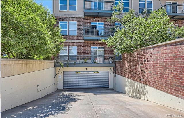 10184 Park Meadows Dr Unit 1317, Lone Tree, CO 80124 - view of building exterior featuring concrete driveway and an attached garage
