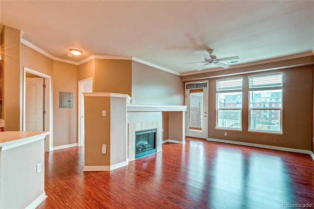 10184 Park Meadows Dr Unit 1317, Lone Tree, CO 80124 - unfurnished living room with wood finished floors, a ceiling fan, a tiled fireplace, crown molding, and electric panel