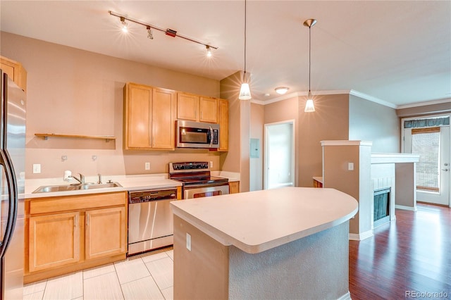 10184 Park Meadows Dr Unit 1317, Lone Tree, CO 80124 - kitchen featuring stainless steel appliances, light brown cabinets, light countertops, ornamental molding, and rail lighting
