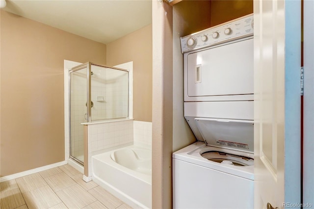 10184 Park Meadows Dr Unit 1317, Lone Tree, CO 80124 - full bath featuring stacked washer / drying machine, a stall shower, a bath, and tile patterned flooring