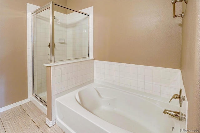 10184 Park Meadows Dr Unit 1317, Lone Tree, CO 80124 - bathroom with a bath, a stall shower, and tile patterned flooring