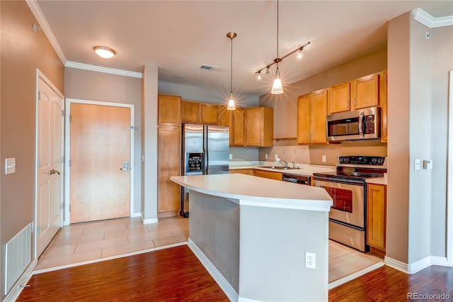 10184 Park Meadows Dr Unit 1317, Lone Tree, CO 80124 - kitchen with appliances with stainless steel finishes, light wood-style floors, light countertops, a center island, and ornamental molding