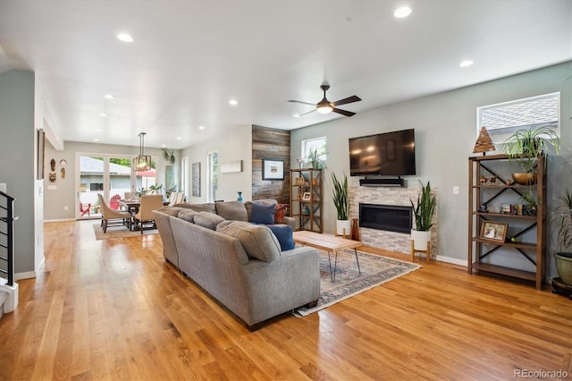 4220 Quitman St, Denver, CO 80212 - living area with a fireplace, light wood-style flooring, recessed lighting, and a ceiling fan