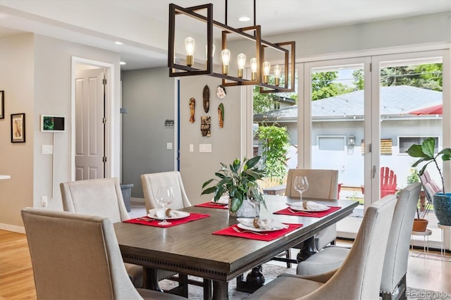 4220 Quitman St, Denver, CO 80212 - dining space with light wood finished floors, recessed lighting, and a chandelier