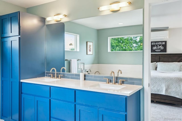 4220 Quitman St, Denver, CO 80212 - full bathroom with connected bathroom, a wall unit AC, and double vanity
