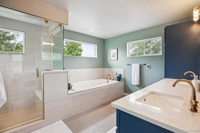 4220 Quitman St, Denver, CO 80212 - bathroom featuring a garden tub, a shower stall, tile patterned flooring, and double vanity