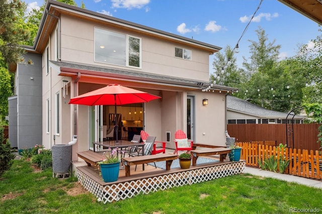 4220 Quitman St, Denver, CO 80212 - rear view of house with a wooden deck and stucco siding
