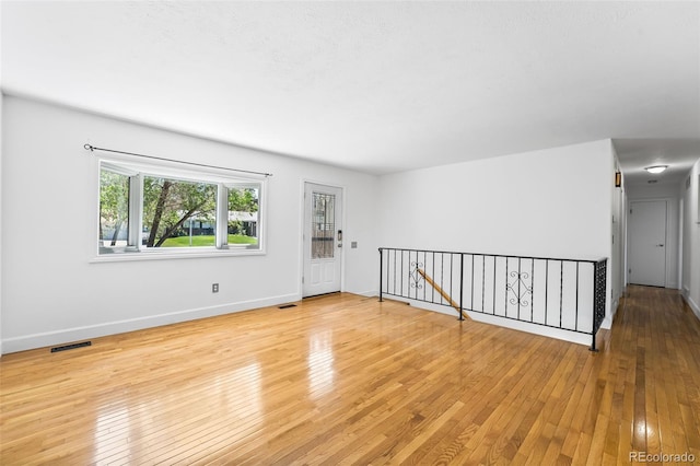 12829 E Nevada Ave, Aurora, CO 80012 - empty room with hardwood / wood-style flooring and baseboards