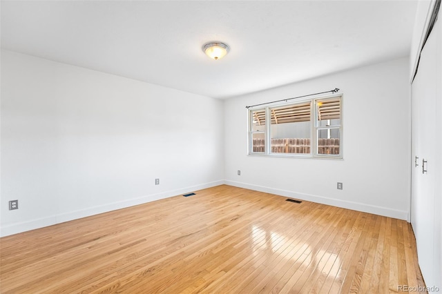 12829 E Nevada Ave, Aurora, CO 80012 - empty room featuring light wood finished floors and baseboards