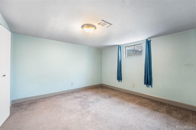 12829 E Nevada Ave, Aurora, CO 80012 - carpeted spare room featuring a textured ceiling and baseboards