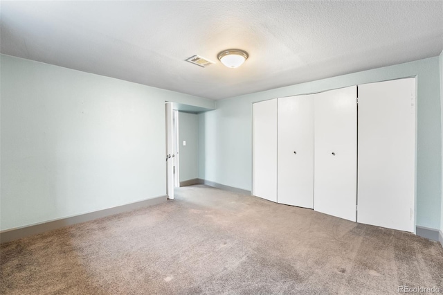 12829 E Nevada Ave, Aurora, CO 80012 - unfurnished bedroom with light carpet and a closet