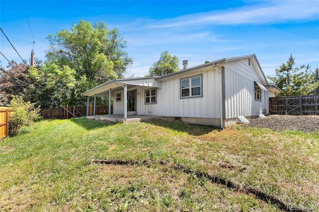 12829 E Nevada Ave, Aurora, CO 80012 - back of house with board and batten siding and a patio