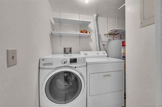 laundry area featuring water heater, laundry area, and independent washer and dryer