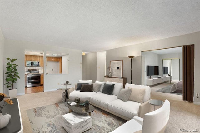 carpeted living room featuring a textured ceiling