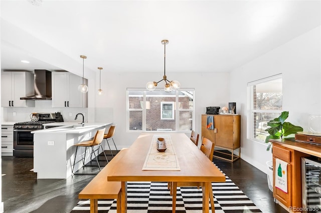 dining room with beverage cooler and a notable chandelier