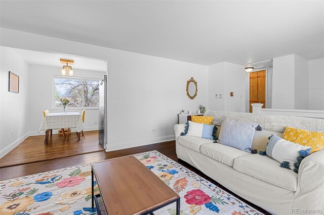 4544 W 65th Ave, Arvada, CO 80003 - living room with baseboards and dark wood finished floors